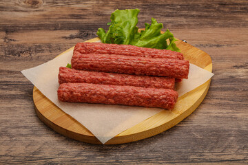 Raw beef sausages with spices