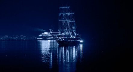 Pirate ship on the water of Mediteranean sea at night - Alanya, Turkey