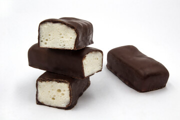 Soft marshmallow covered with chocolate. Original name literally mean 