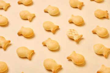 fish crackers on beige background top view