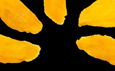 Dried mango isolated on black background.