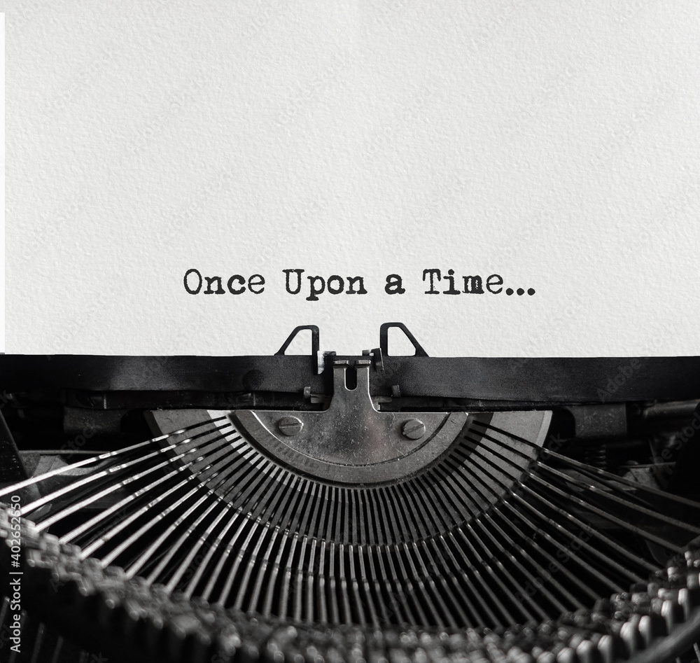 Fototapete mechanical typewriter at the center with a white sheet of paper. metallic type machine with written 