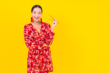 Portrait beautiful young asian woman with chopsticks