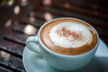 Coffee in white cup on table at coffee shop