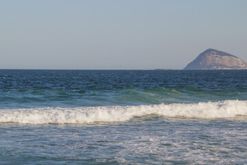 Fototapeta na wymiar Waves at the famous Copacana in Rio de Janeiro, Brazil