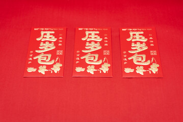 Chinese New Year Red Packets on Red Background