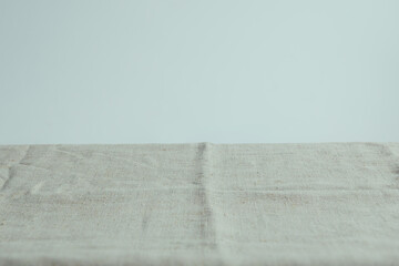 Background for the item with beige linen fabric, item can be put.