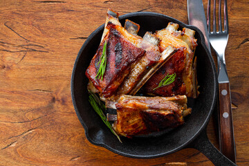  Grilled ribs in barbecue sauce on the pan top view