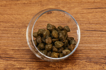 Tasty capers in the bowl