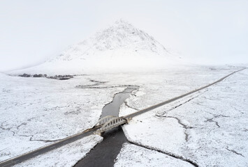Buachaille Etive Mor covered in snow during winter aerial view © Richard Johnson