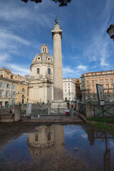 Fototapeta na wymiar Trajan's Column(Colonna Traiana)is a Roman triumphal column in Rome,Italy.Completed in AD113.The most famous is spiral bas relief, which artistically represents the wars between the Romans and Dacians