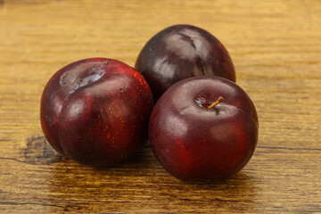 Ripe sweet plum fruit heap