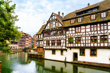 Fototapeta na wymiar Colorful half timbered houses on the banks of River Ill in Strasbourg, Alsace region, France