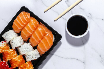 Japanese food concept to go. Sushi take away assortment