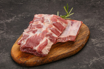 Fototapeta na wymiar Raw pork ribs served rosemary