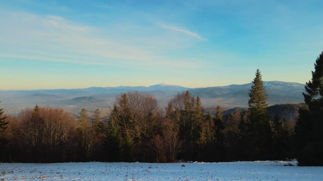 Aerial footage of Beskidy Mountains with Babia G&oacute;ra on horizon.

