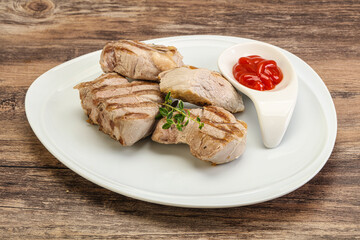 Grilled pork tenderlion with tomato sauce