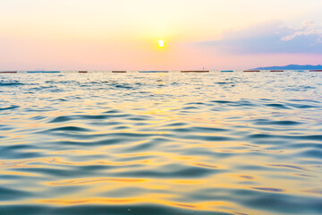Fototapeta na wymiar Sea wave beach sunset light