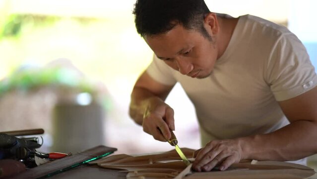 craft man making guitar on wood table, capenter working concept