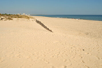 Sandy beach on the Farol Island near Faro, Algarve - Portugal 