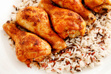 Indian cuisine: roasted chicken with rice and vegetables.