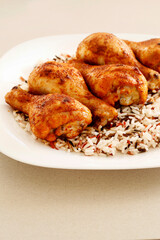 Indian cuisine: roasted chicken with rice and vegetables.