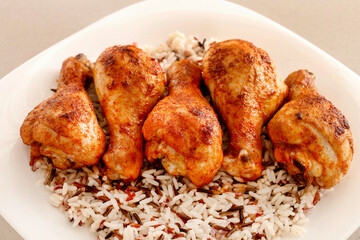 Indian cuisine: roasted chicken with rice and vegetables.
