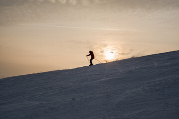 a man on mountain skis at high speed rides on a mountain