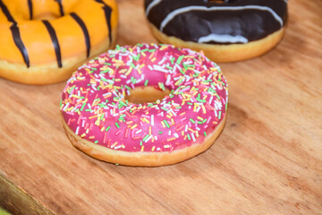 multicolored donuts yellow pink chocolate