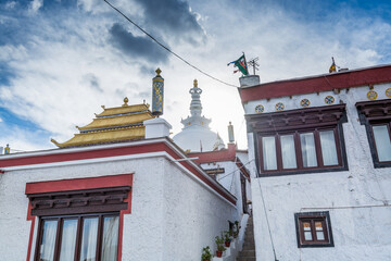 Tibetan Monastery with background of Shanti Stupa, at the Leh city, Ladakh of the Jammu and Kashmir