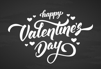 Handwritten elegant modern brush lettering of Happy Valentines Day with hearts on chalkboard background.