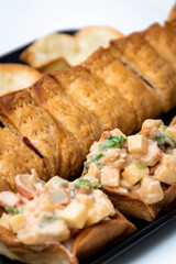 Vertical view of puff pastry and crab cocktail tops. Crab, apple, pineapple and crab salad