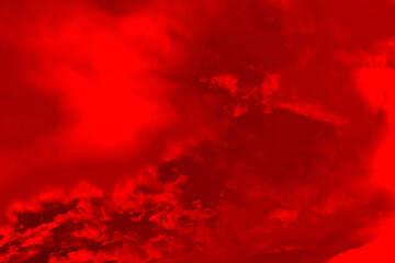 Abstract red background with a dark red tint. Cloudy celestial texture in a creative way.