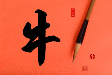 Chinese calligraphy translation: year of the ox,seal translation: Chinese calendar for the year of...