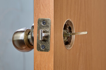 The spindle of the knob mechanism is visible from the back of door.