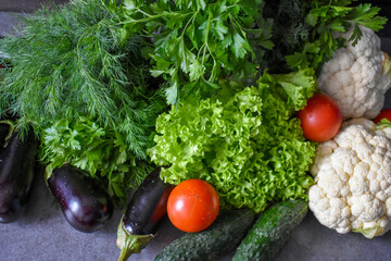 Various vegetables and herbs on the table