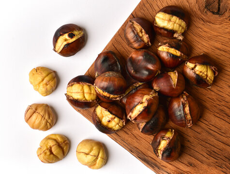 Roasted chestnut on wooden table.
