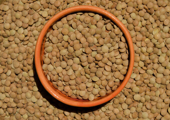 legumes, beans and lentils on wooden bottom and clay sources