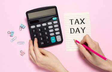 Calculator and tax day written on the agenda