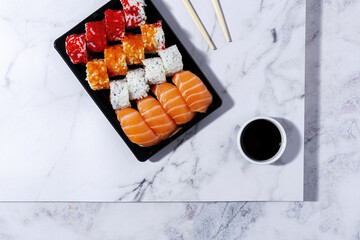 Japanese food concept to go. Sushi take away assortment