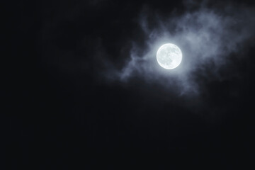 Fototapeta na wymiar moon shining on the cloudy sky