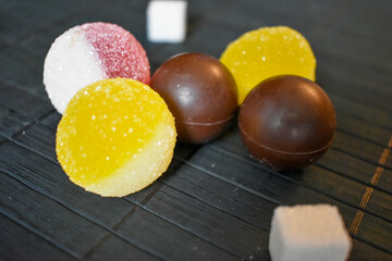 Round marmalade, chocolates and sugar cube