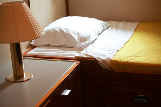 Bed and lamp in hut
