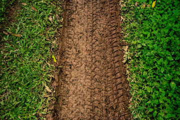 Tyre track on dirt sand or mud, Picture in retro or grunge tone. Car drive on sand. off road track....