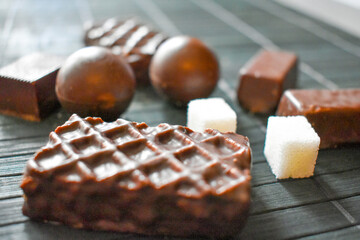 Chocolates and sugar cubes on the table