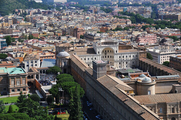View of city houses and rooftops. Clear sunny day