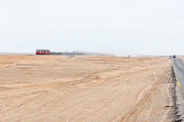 Train next to road C14 between Swakopmund and Walvis bay