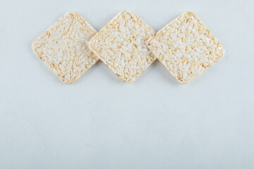 Delicious airy crispbread on white background