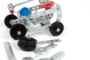 a toy assembled by a child from parts of a metal construction set