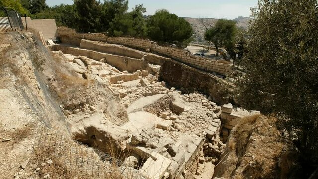 A geological excavation site in the vicinity of the old city of Jerusalem, some of the newer city is visible in the background, a 4K video clip, Jerusalem, Israel.